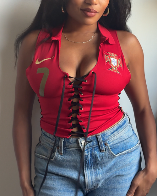 Custom red Portugal soccer jersey sleeveless crop top with a collar, black lace-up front, a gold Nike swoosh, Cristiano Ronaldo number 7. 